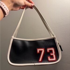 Sporty-Chic Black Mini Purse With Red And White Detail